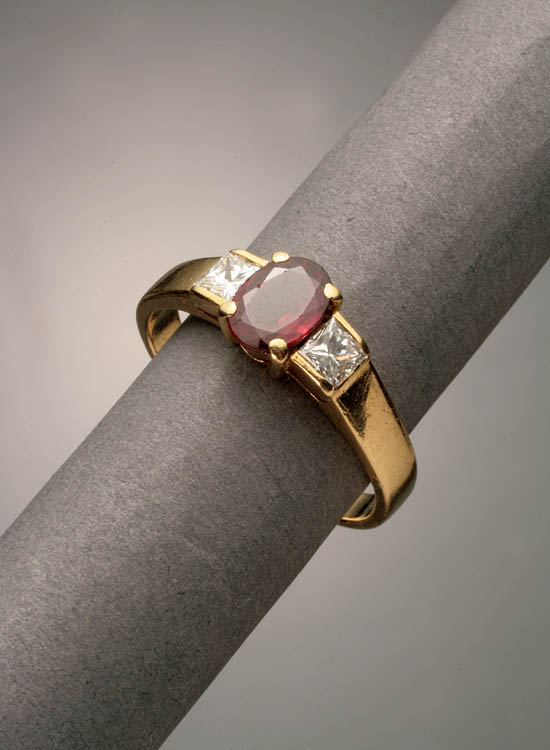 Appraisal: -Karat Yellow-Gold Ruby and Twin-Diamond Dinner Ring The four-prong mount