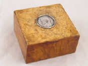 Appraisal: A Russian birch square box the lid inset with a