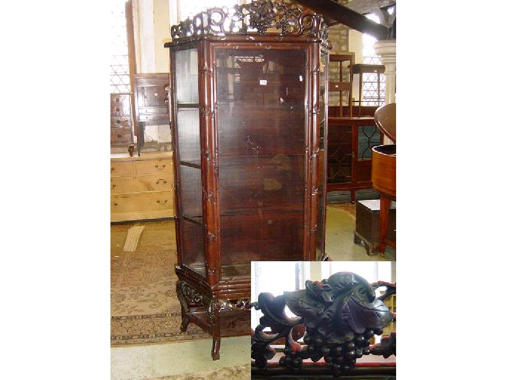 Appraisal: A Chinese hardwood breakfront display cabinet with simulated bamboo mouldings