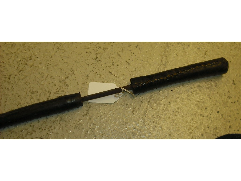 Appraisal: th century leather covered riding crop swordstick long