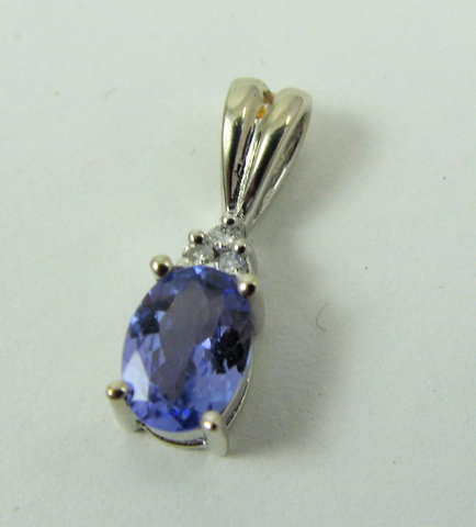 Appraisal: TANZANITE AND DIAMOND PENDANT k white gold and set with