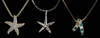 Appraisal: Three Necklaces with Pendants gold starfish accented with approximately round