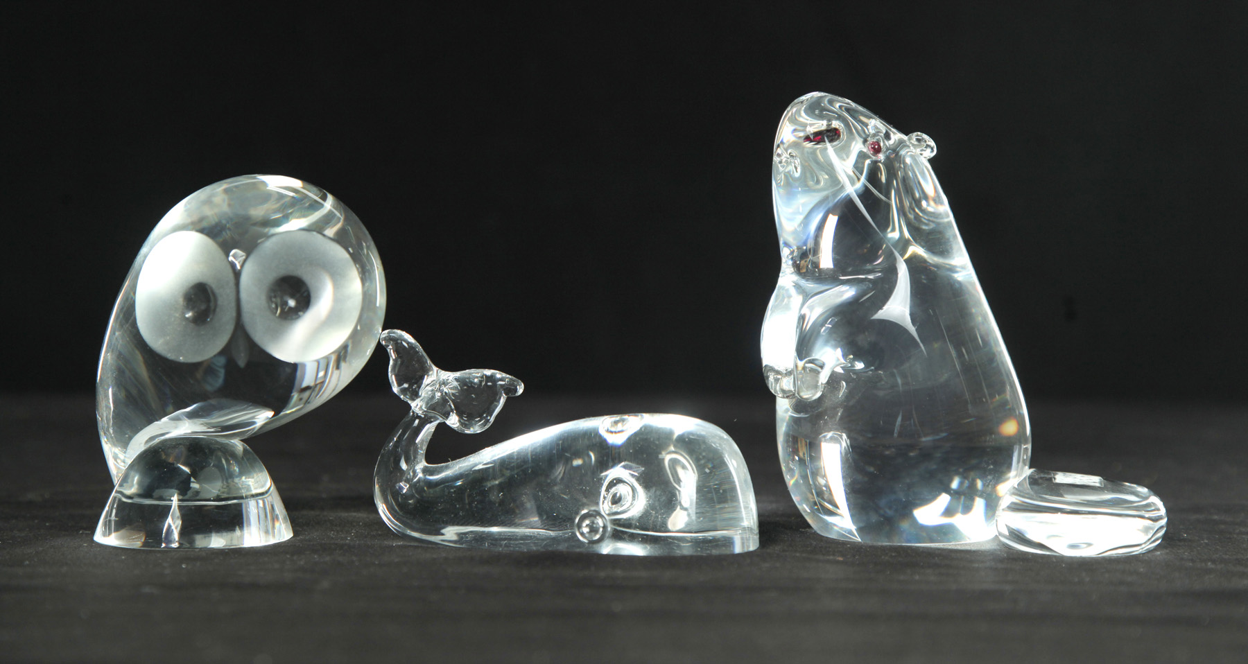 Appraisal: THREE STEUBEN CLEAR GLASS FIGURES American nd half- th century