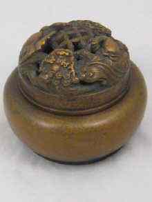 Appraisal: A Chinese bronze incense burner the pierced cover as lions