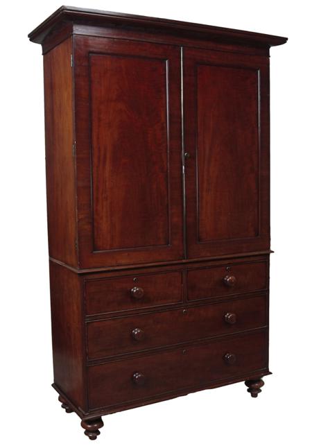 Appraisal: A Victorian mahogany linen press the projected moulded cornice over