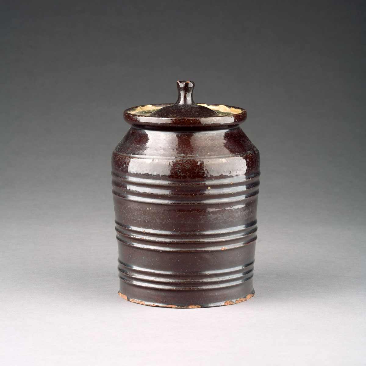 Appraisal: AMERICAN GLAZED REDWARE JAR AND COVER POSSIBLY SOUTHERN NINETEENTH CENTURY