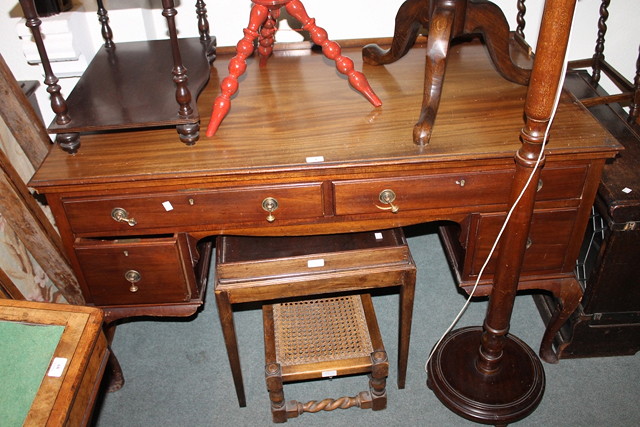 Appraisal: AN EDWARDIAN WALNUT DESK fitted with an arrangement of drawers