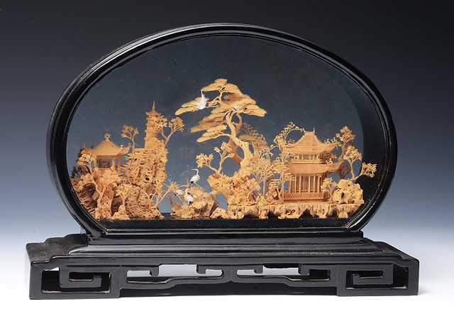 Appraisal: AN ORIENTAL FINELY CARVED CORK MODEL OF A LANDSCAPE decorated