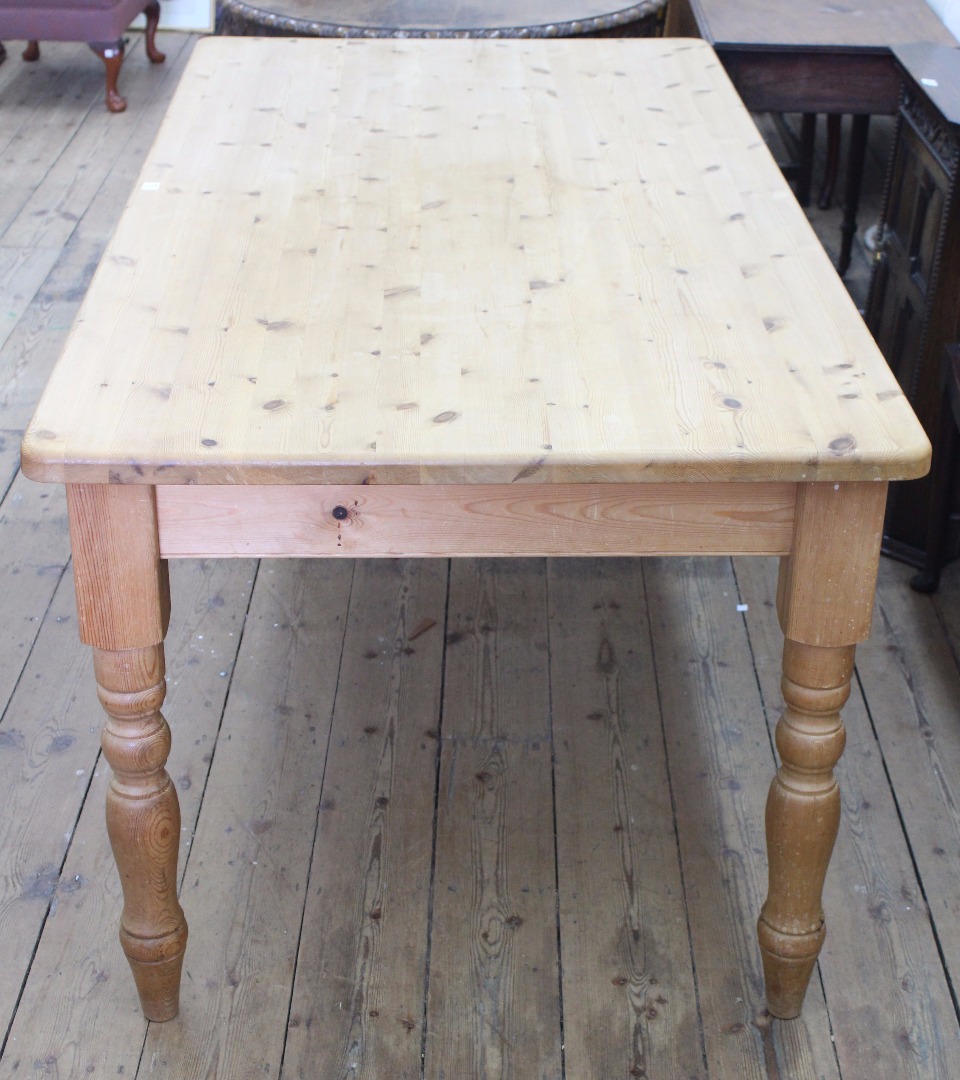 Appraisal: A pine kitchen table th century the rectangular top over