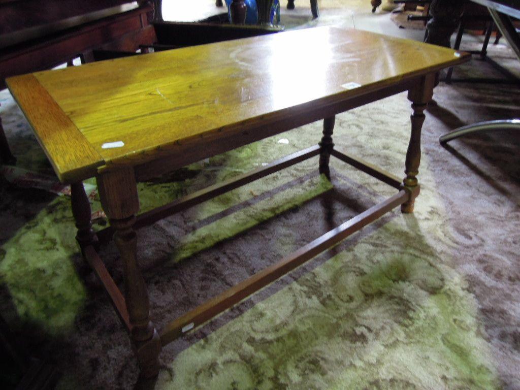 Appraisal: An oak occasional table the rectangular top with cleated ends