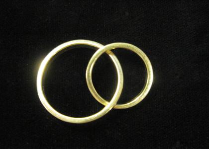 Appraisal: Two karat yellow gold interlocking rings Tiffany Co One signed