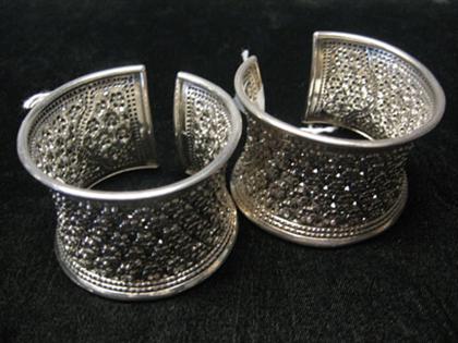 Appraisal: Set of two sterling cuffs Two wide matching sterling cuffs