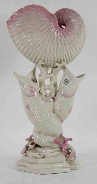 Appraisal: A Belleek double fish and nautilus vase the shell and