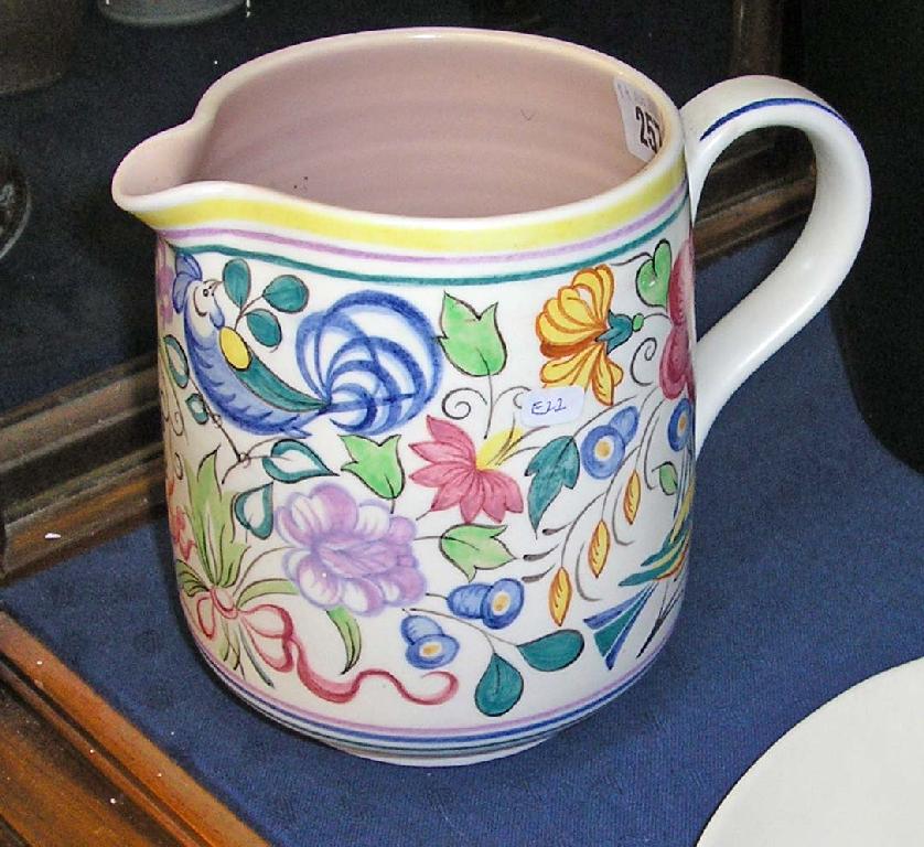 Appraisal: A Poole pottery jug decorated with blue birds amongst foliage