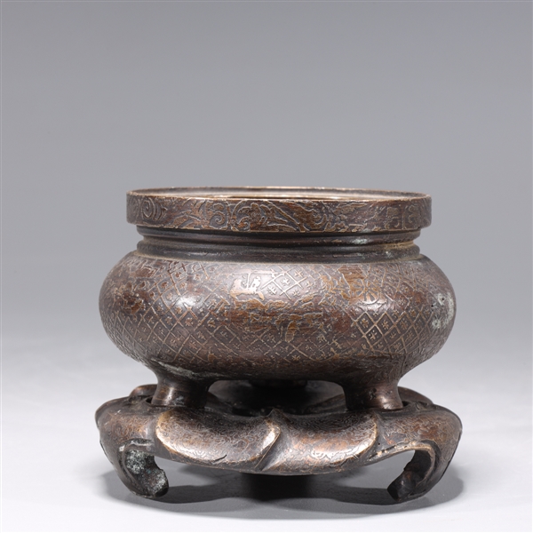 Appraisal: Chinese bronze tripod censer with intricate detail to body and