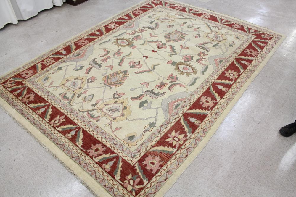 Appraisal: HAND KNOTTED ORIENTAL CARPET Pakistani-Persian overall stylized floral design on