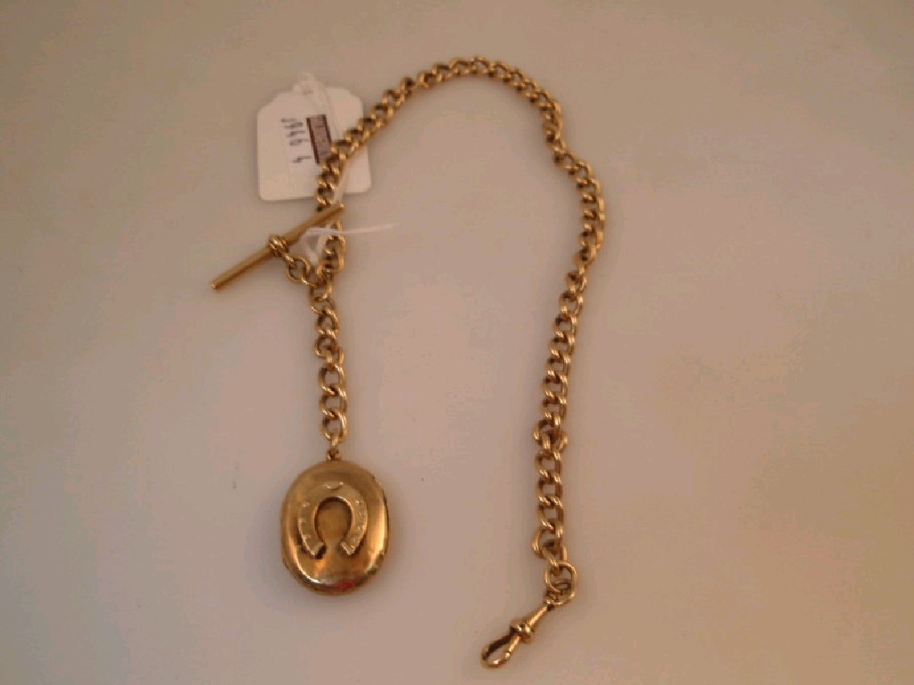 Appraisal: A yellow metal Albert with locket and T bar attached