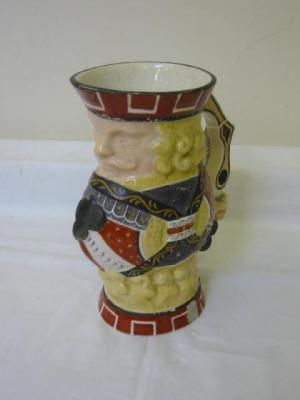 Appraisal: A STAFFORDSHIRE POTTERY JUG modelled as the King of Clubs