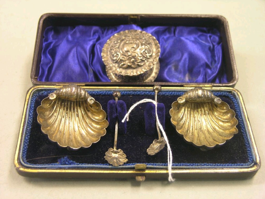 Appraisal: A pair of late Victorian silver salts shell-shape with server