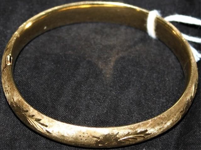 Appraisal: KT ENGRAVED YELLOW GOLD HINGED BANGLE BRACELET HIGH WIDE DWT