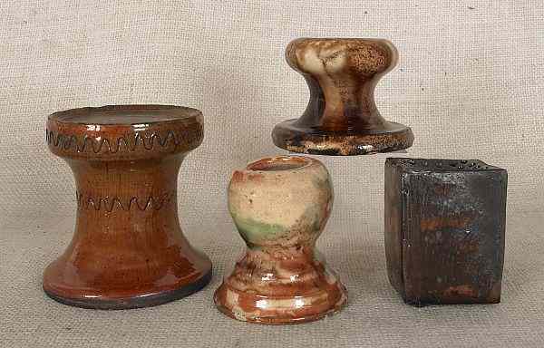 Appraisal: Three redware stove feet th c to include a Shenandoah