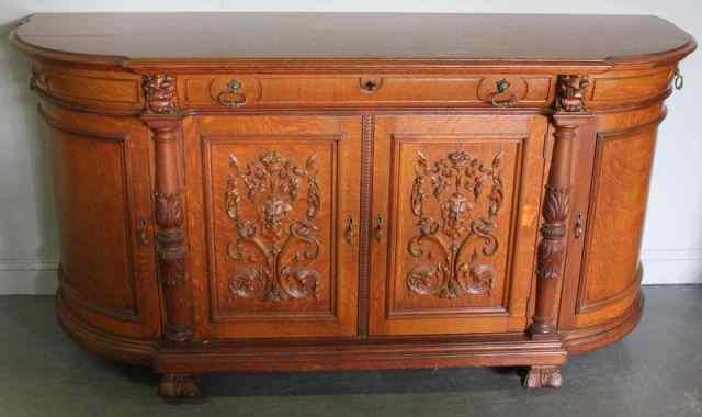 Appraisal: Quartersawn Oak Curved End Server Well carved with lions' heads