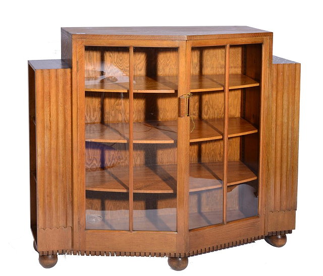 Appraisal: A HEALS OAK GLAZED BOOKCASE with triangular shaped front glazed