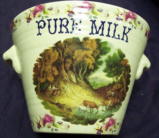 Appraisal: A two-handled milk pail transfer printed cattle in landscape and