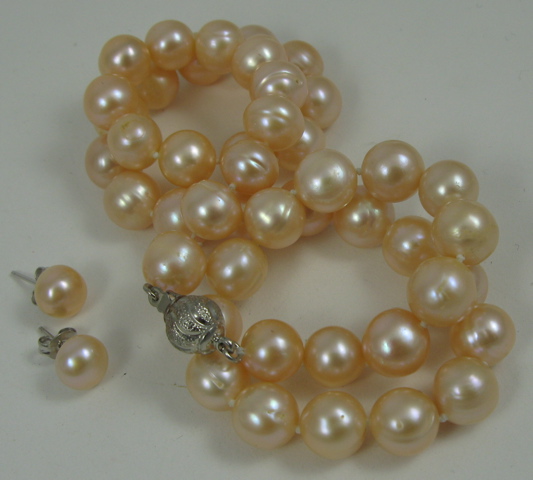 Appraisal: THREE ARTICLES OF PINK PEARL JEWELRY including a pink pearl