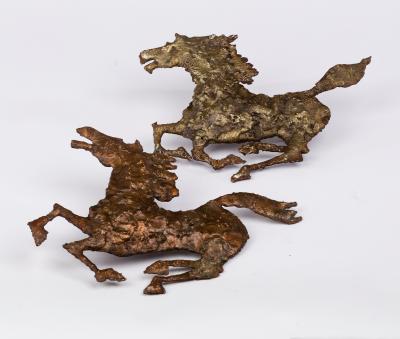 Appraisal: A pair of metalwork galloping horses s approximately cm wide