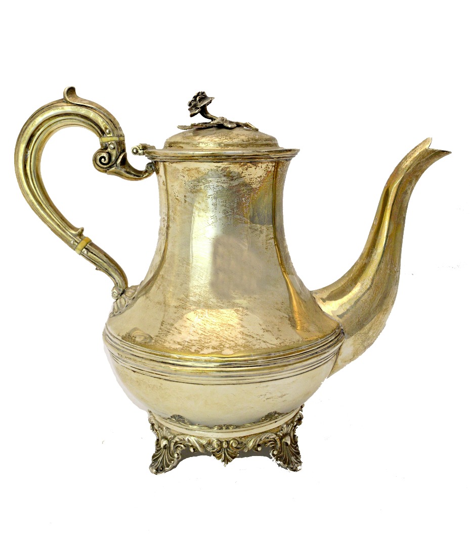 Appraisal: A silver teapot decorated with a central band having a