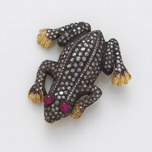 Appraisal: A diamond ruby silver-topped k gold and metal brooch in