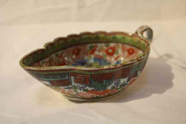 Appraisal: A CHINESE CLOBBERED IMARI SAUCE BOAT the bowl painted with