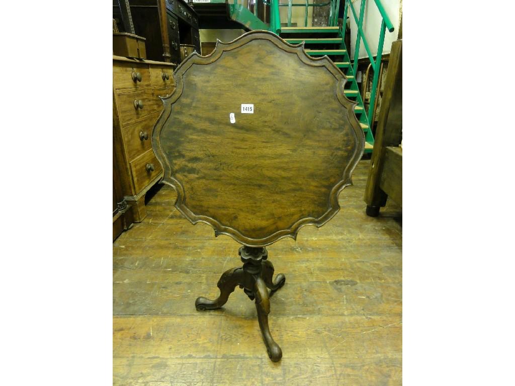 Appraisal: A Georgian style walnut snap top occasional table of circular