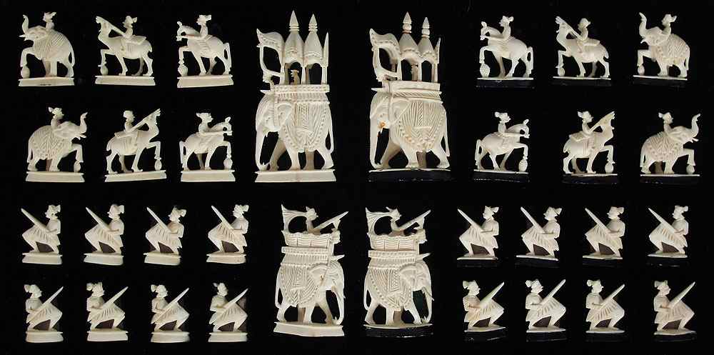 Appraisal: CHINESE CARVED IVORY CHESS SET Complete set featuring carved elephants