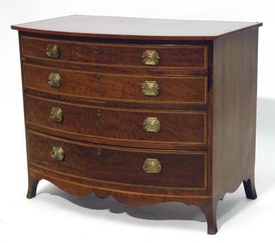 Appraisal: A GEORGE III MAHOGANY CHEST of bow fronted form with