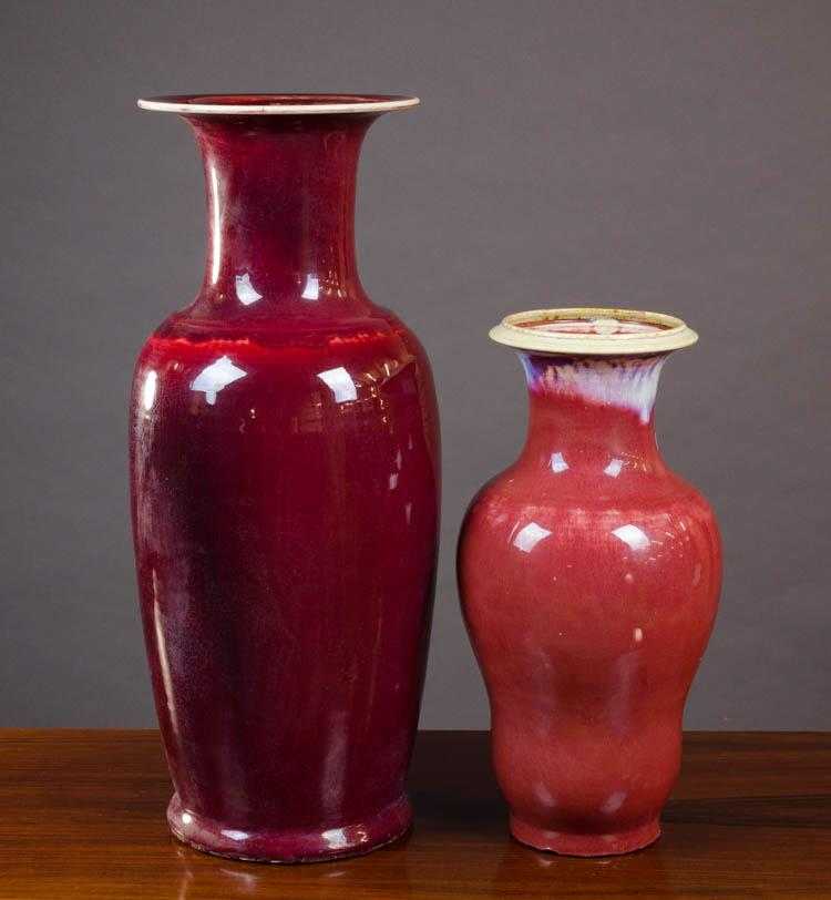 Appraisal: TWO CHINESE FLAMBE GLAZE PORCELAIN VASES the taller of baluster