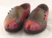 Appraisal: A pair of Dutch clogs painted as fashion leather shoes