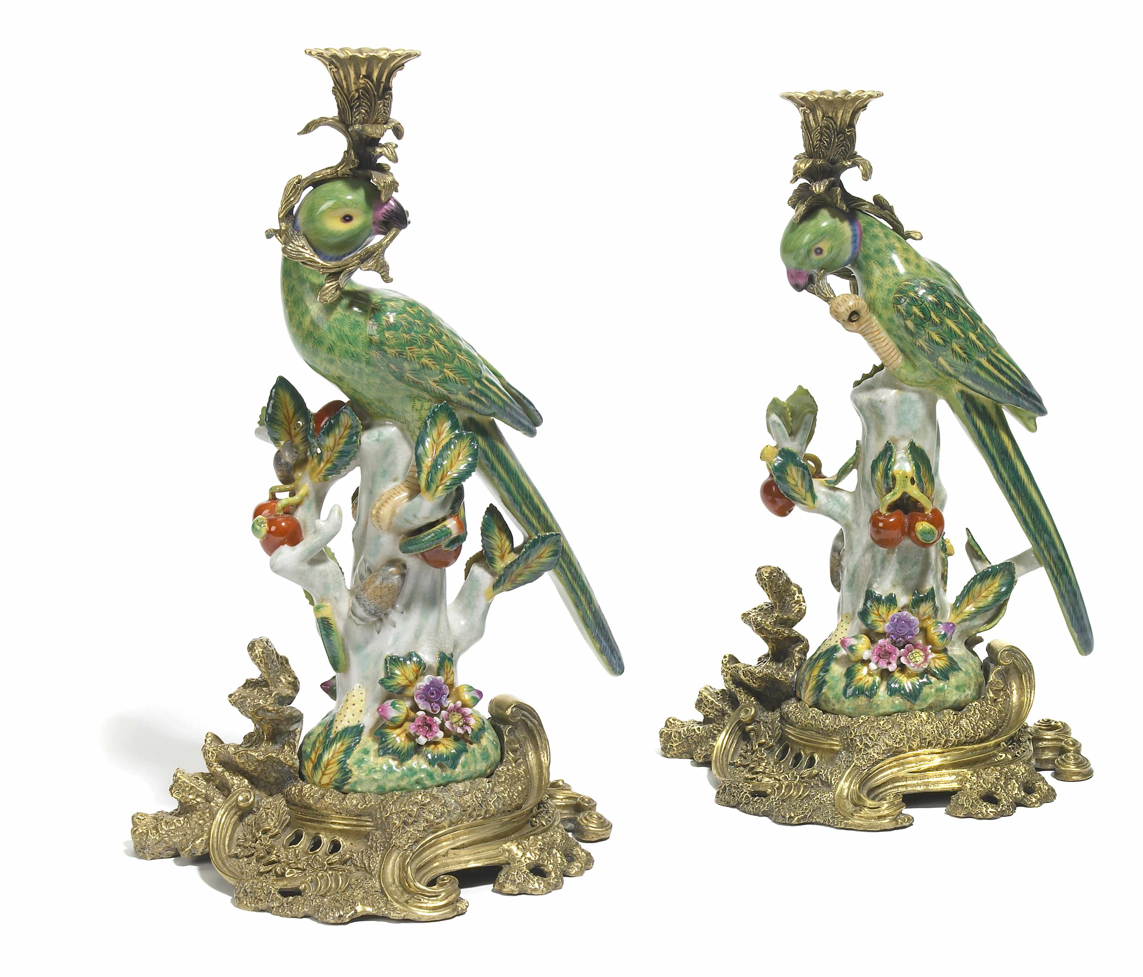 Appraisal: A pair of paint decorated and gilt bronze mounted glazed