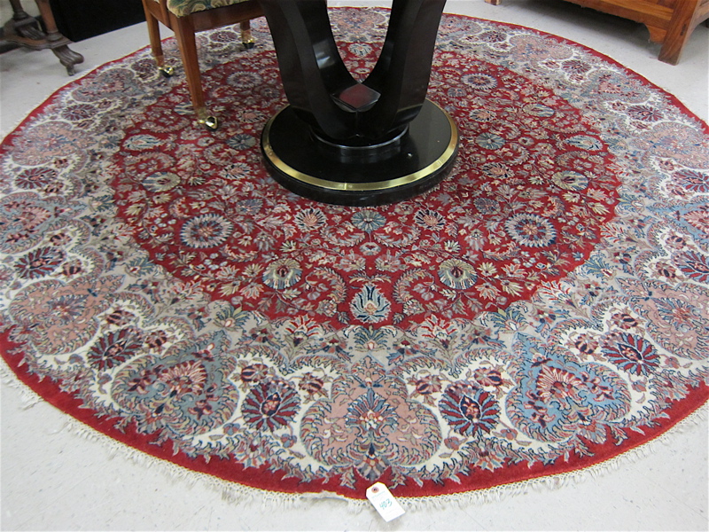 Appraisal: A ROUND ORIENTAL CARPET Indo-Persian floral and central floral medallion