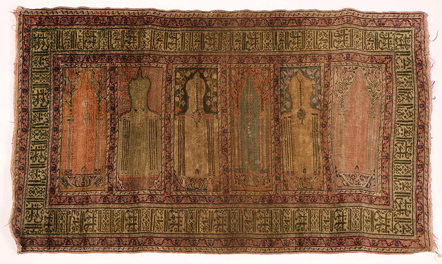 Appraisal: AN OLD PERSIAN RUG decorated with six panels of mihrabs