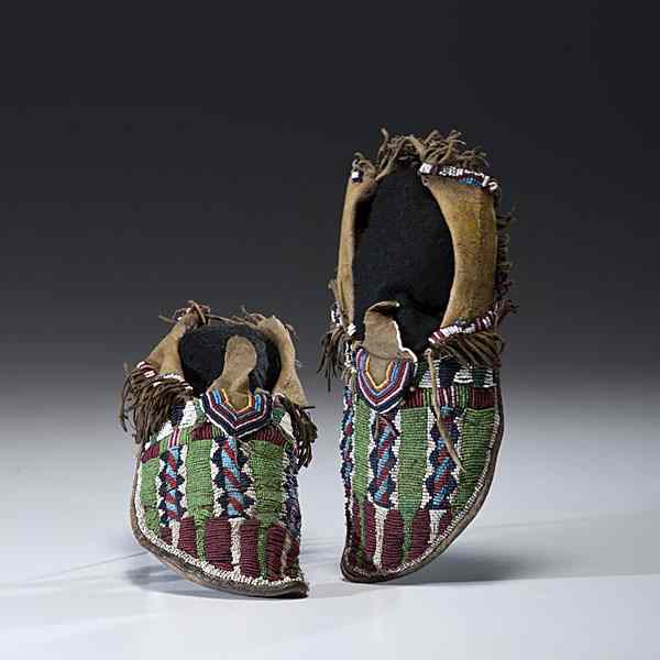 Appraisal: Kiowa Beaded Hide Moccasins sinew-sewn and beaded using colors of