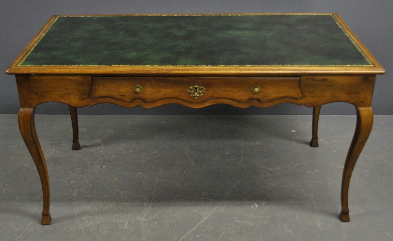 Appraisal: - French Provincial style fruitwood desk with green leather top