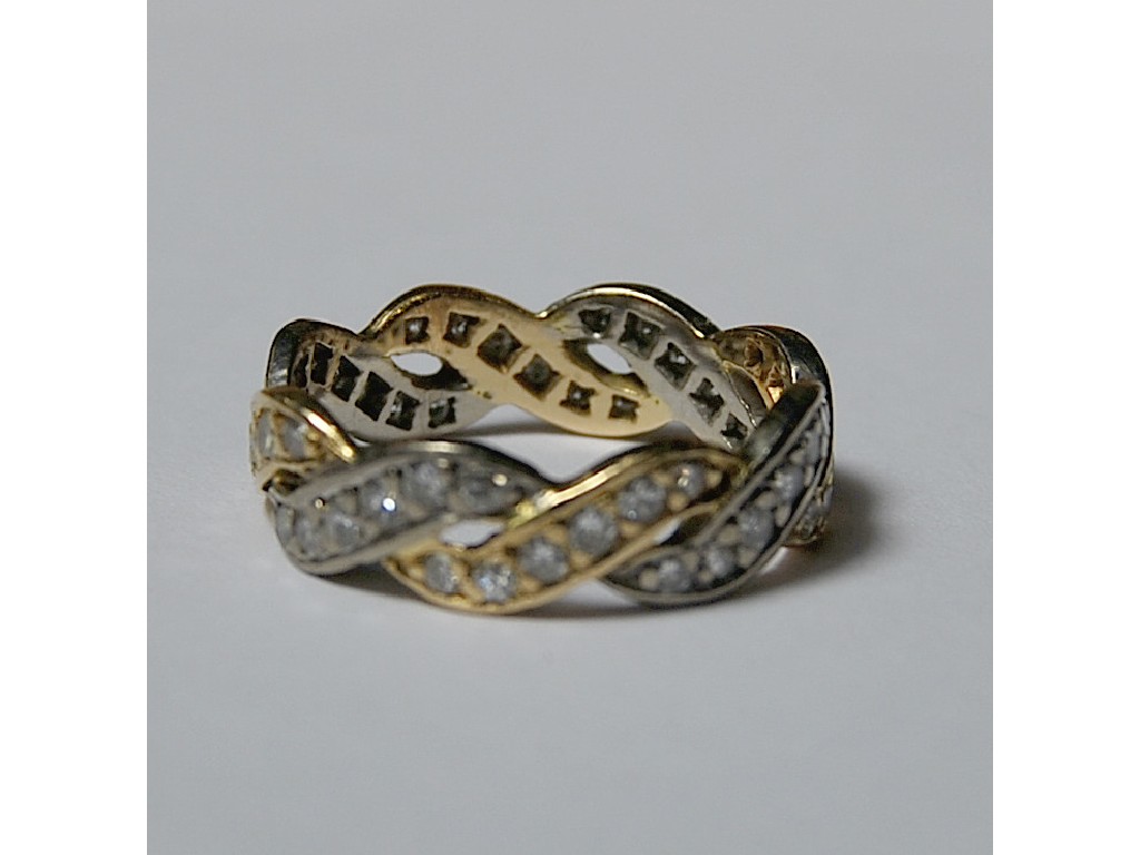 Appraisal: Twisted-style diamond set full eternity ring yellow and white metal