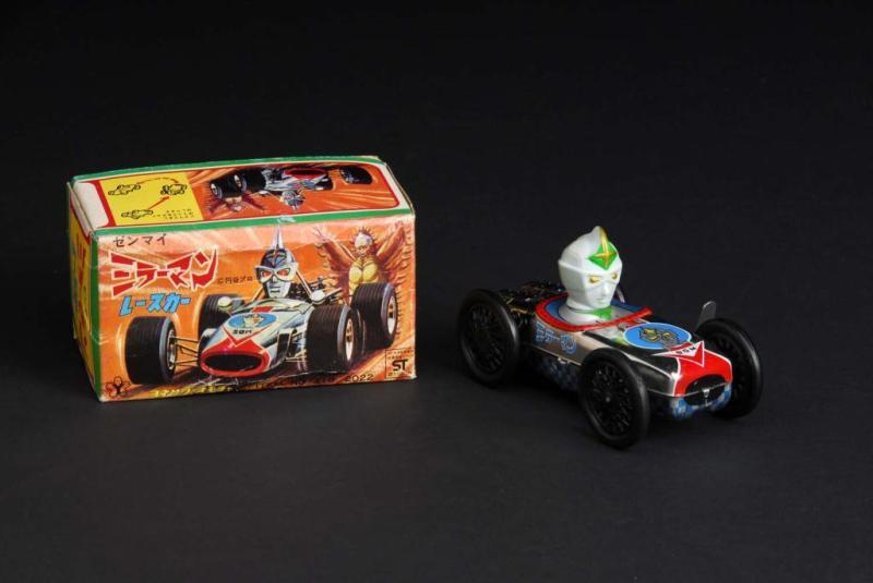 Appraisal: Mirror Man Driving Race Car Toy Description Japanese Made by