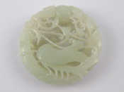 Appraisal: A Chinese white jade circular pendant deeply carved and pierced