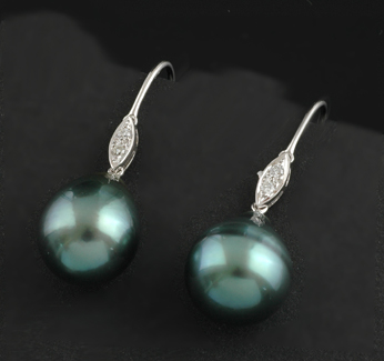 Appraisal: A pair of Tahitian pearl and diamond earrings The tear