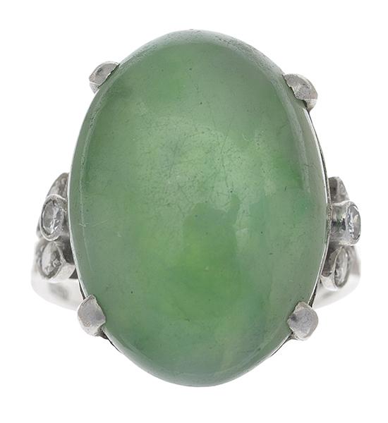 Appraisal: AN ART DECO JADE AND DIAMOND RING Featuring an oval