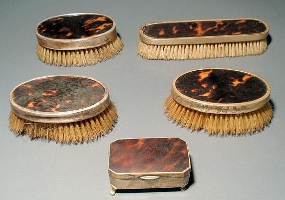 Appraisal: English silver and tortoiseshell dresser set four brushes and box