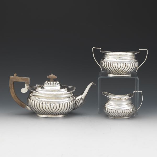 Appraisal: VICTORIAN ENGLISH STERLING SILVER THREE-PIECE TEA SERVICE BY THOMAS HAYES